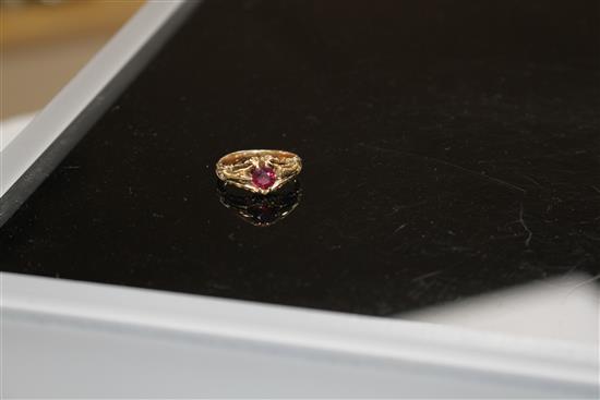A late Victorian yellow metal and claw set solitaire garnet ring, size J, gross 4.2 grams.